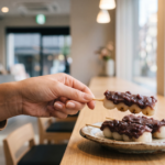Anko dango Japanese rice dumplings with sweet red bean paste on bamboo skewers