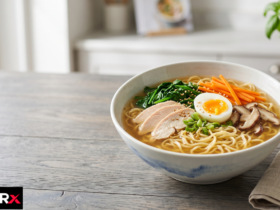 Bowl of egg noodles with vegetables beside a nutrition label asking are egg noodles good for you